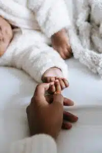 mom and baby hand