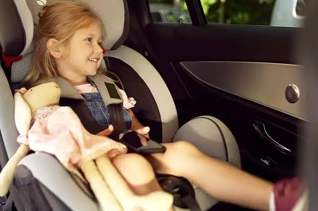 toddler sitting in a forward-facing CarSeat