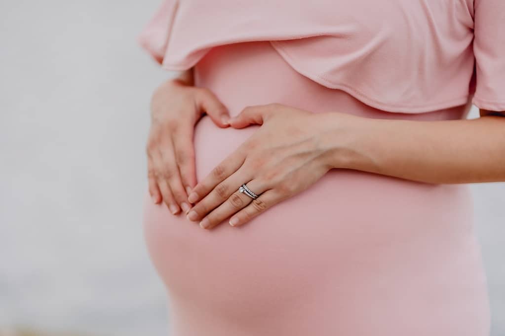 pregnant woman wearing pink