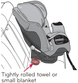 rolled towel underneath booster seat