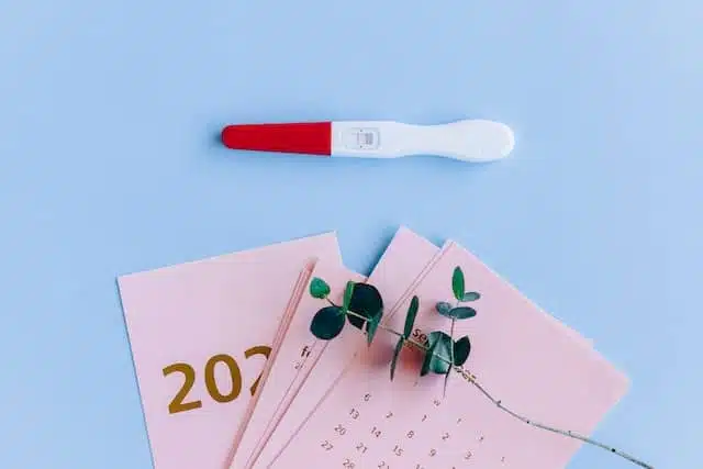 pregnancy test kit on a calendar - due date